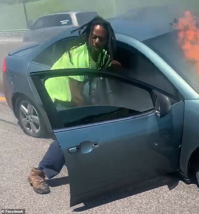 Motorcyclist pulls unconscious driver from burning car on I-70.